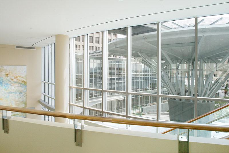 Interior photo of Baptist Heart Hospital, looking out window and over balcony.