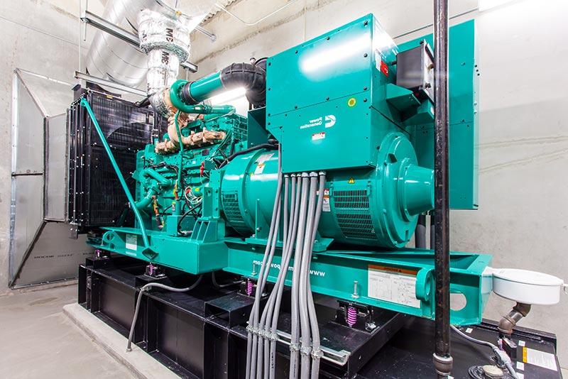 Photo from inside the central energy plant. Aqua colored generator.